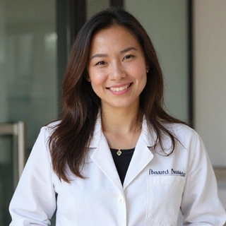 Portrait of Dr. Anya Wijaya, a senior clinical nutritionist at NutriLife Indonesia, smiling confidently.